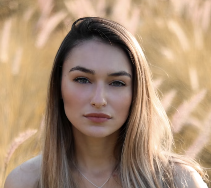 Young woman outdoor field portrait